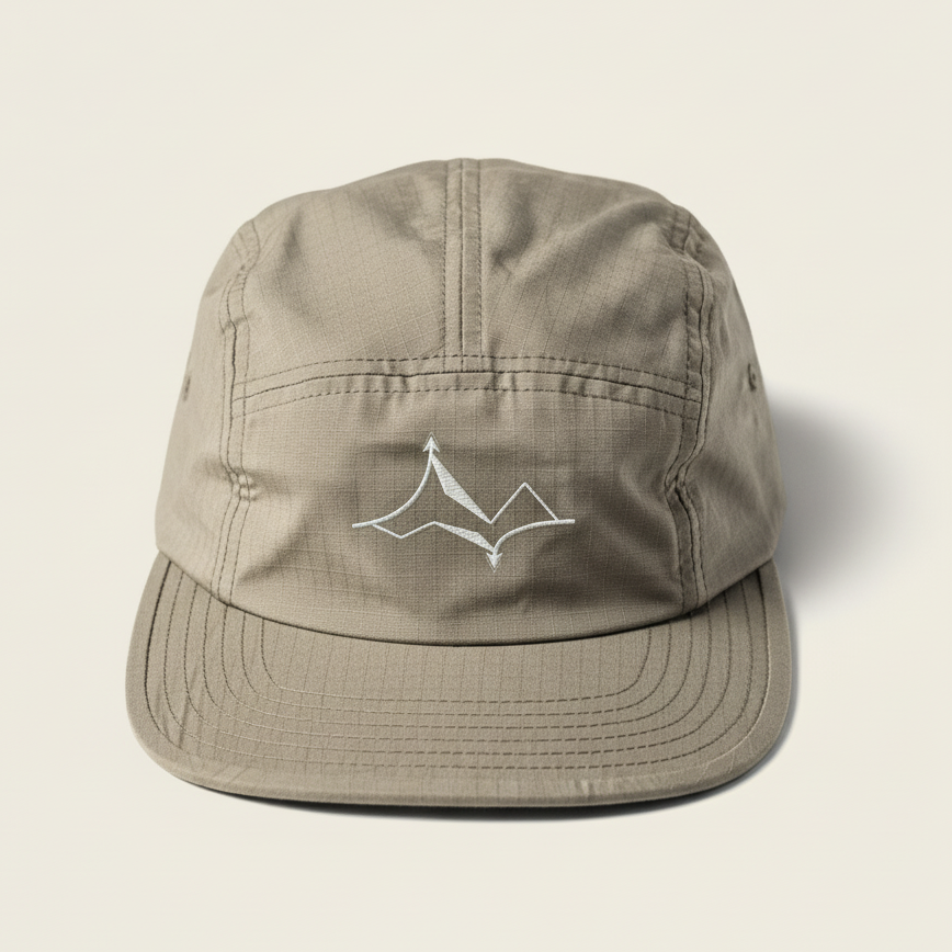 Beige cap with a logo on a light beige background ripstop cotton hat ripstop hat five panel cap