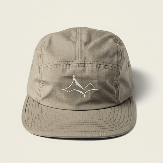 Beige cap with a logo on a light beige background ripstop cotton hat ripstop hat five panel cap 